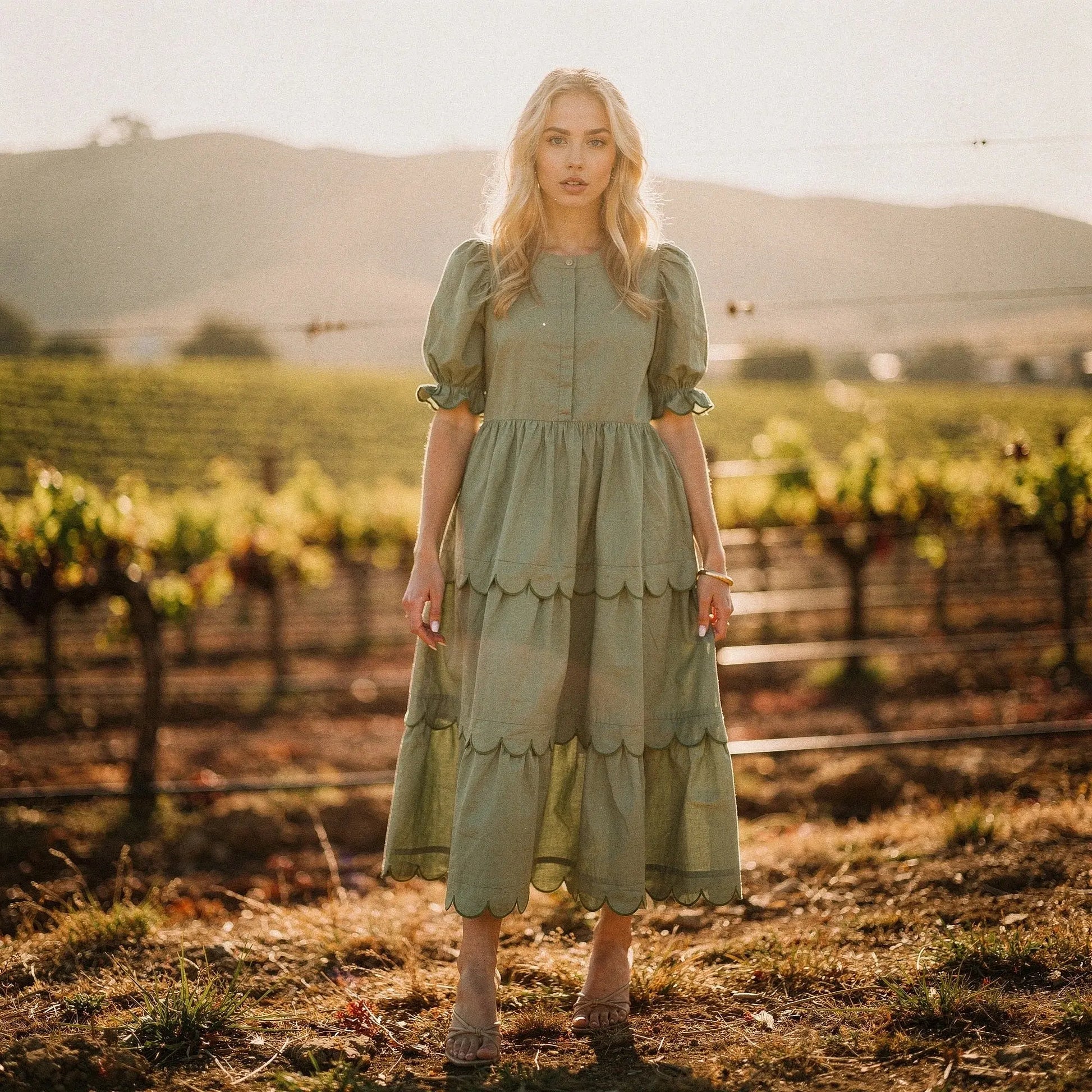 View of a light blue A line midi dress featuring a round neck and flowy fabric, perfect for casual summer occasions
