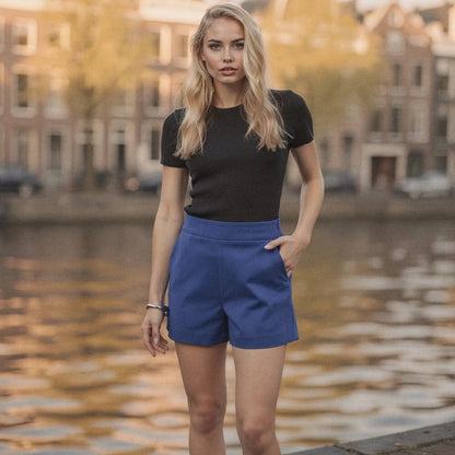 Light gray high waist mini length shorts made from soft cotton, featuring a relaxed fit and pockets, view