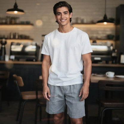 View of relaxed fit linen drawstring shorts in light beige, featuring knee length cut and comfortable waistband