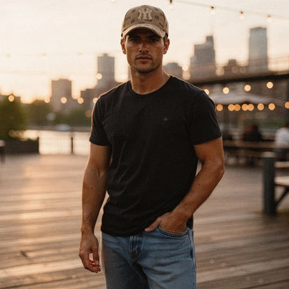 View of a navy blue slim fit crew neck short sleeve casual tee, showcasing soft cotton material and neat stitching