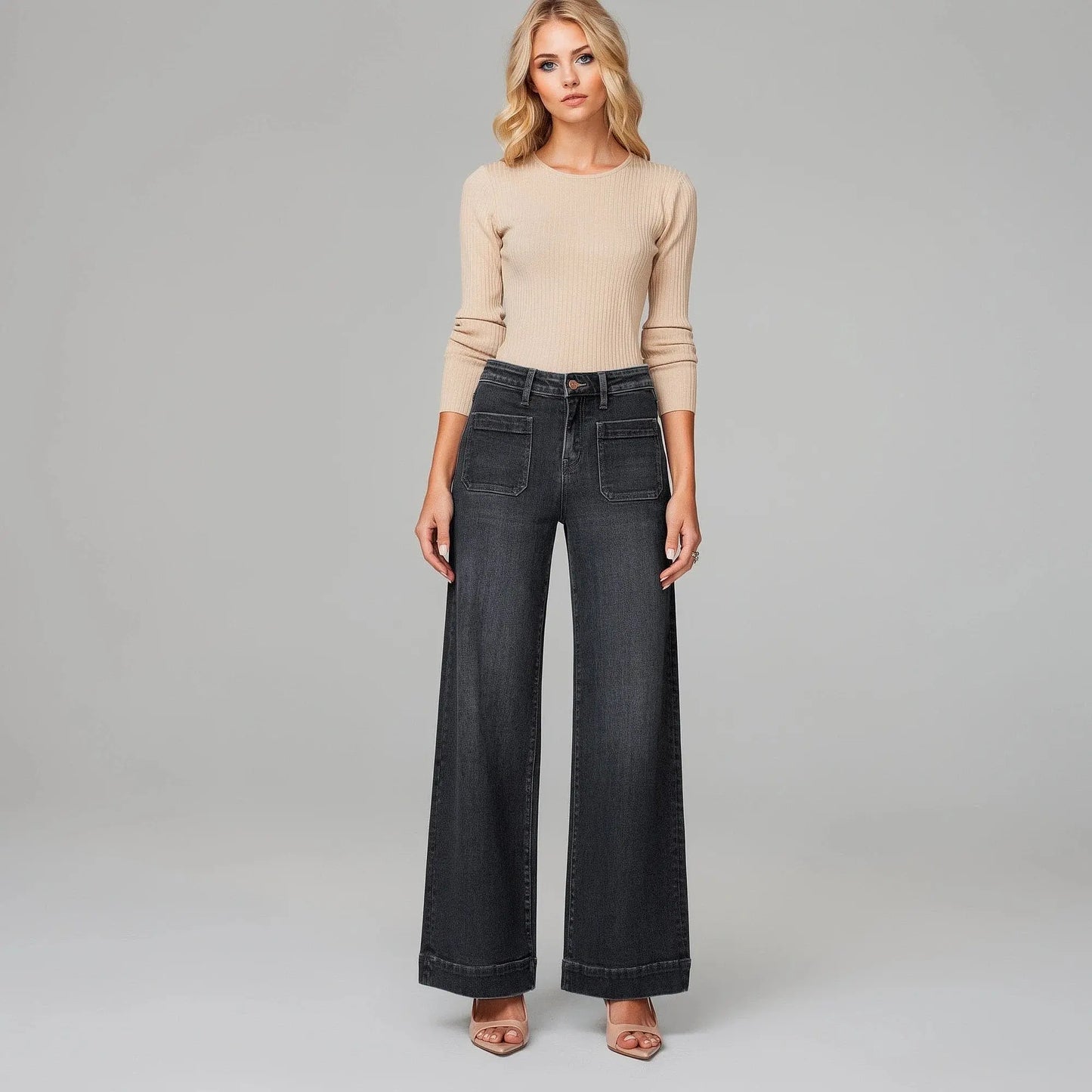 View of women's slim fit high waist classic retro jeans in dark blue denim, featuring a clean silhouette and subtle stitching details
