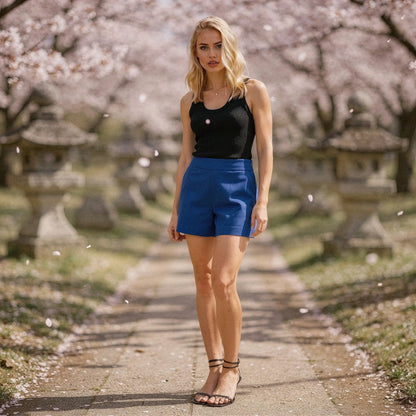 Light gray high waist mini length shorts made from soft cotton, featuring a relaxed fit and pockets, view