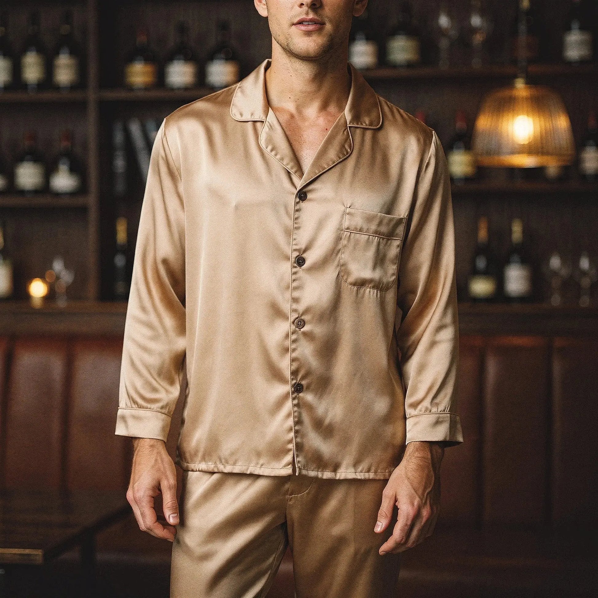 View of a pure silk pajama set featuring a relaxed fit, long sleeves, and a notch collar in a soft, muted color