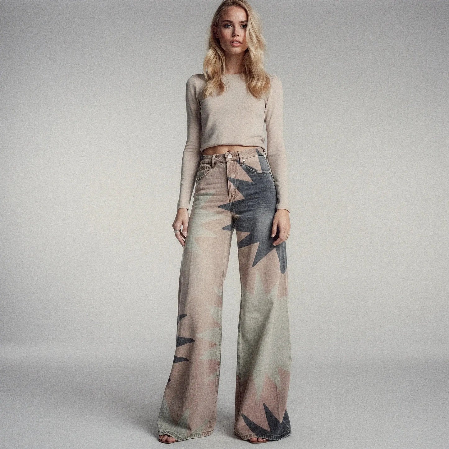 View of women's wide leg casual pants featuring a geometric print in vibrant colors and lightweight fabric
