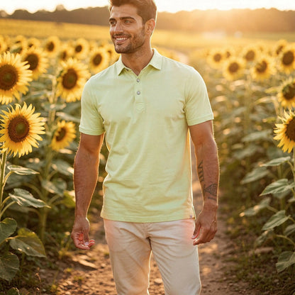 View of a navy blue slim fit short sleeve polo shirt featuring a V neck and soft cotton material