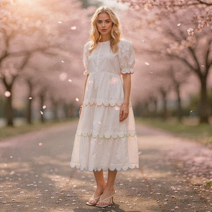 View of a flowy A line midi dress in soft fabric, featuring a round neck and vibrant floral print, perfect for summer