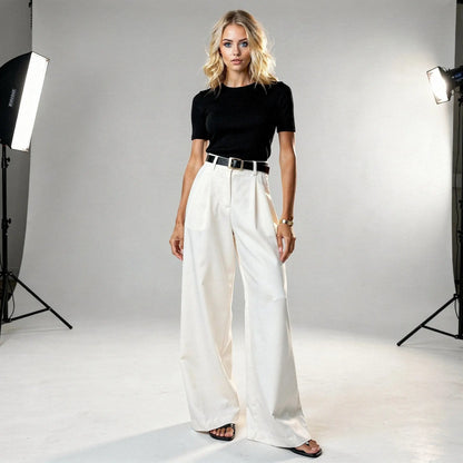 View of relaxed fit wide leg full length casual pants in soft fabric, featuring a neutral beige color and a comfortable waistband
