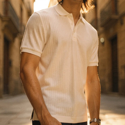 View of a slim fit short sleeve polo t shirt in light blue, made of breathable cotton, featuring a classic collar and subtle stitching