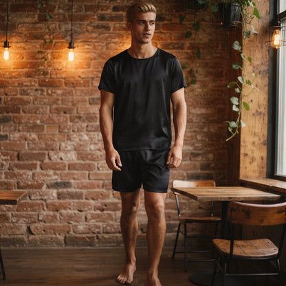 View of a relaxed fit short sleeve pajama set in light gray, featuring a round neck and comfortable shorts