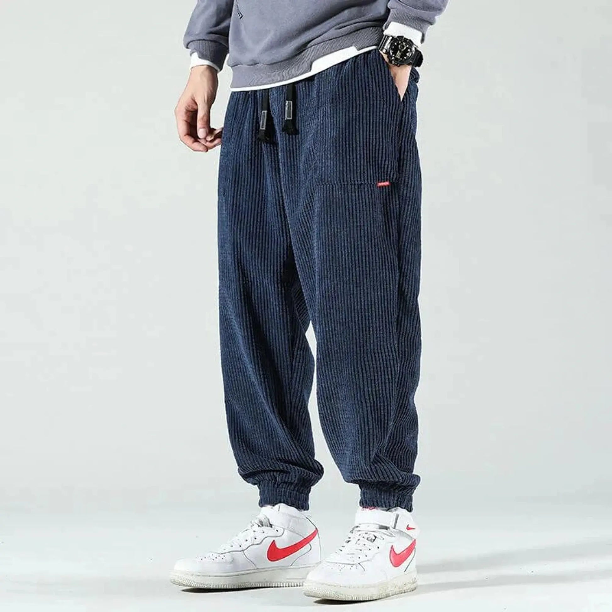 View of relaxed fit tapered joggers in soft tan corduroy with a drawstring waist and pockets