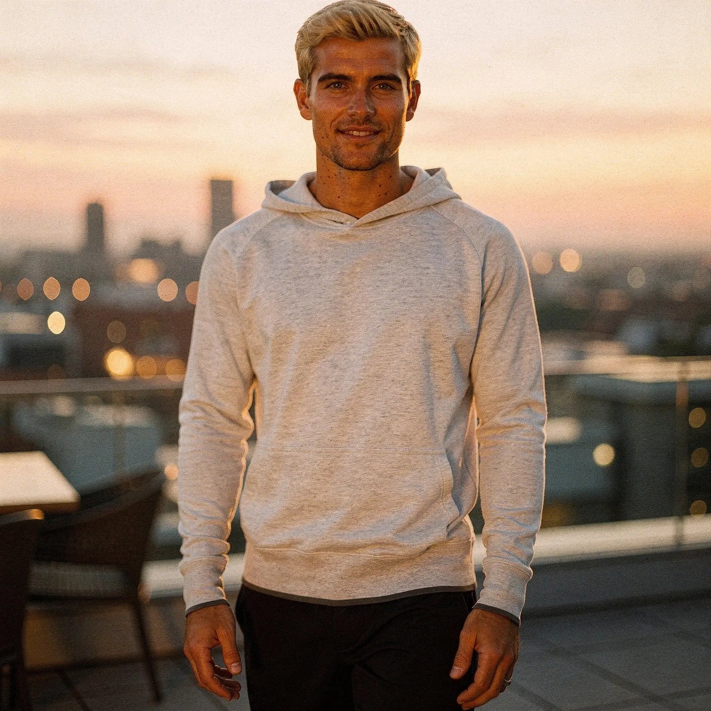 View of a relaxed fit crew neck long sleeve casual hoodie in dark gray, featuring ribbed cuffs and a soft fabric texture