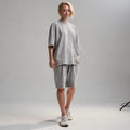 View of a relaxed fit crew neck short sleeve midi dress in soft cotton fabric, featuring a solid color and casual style