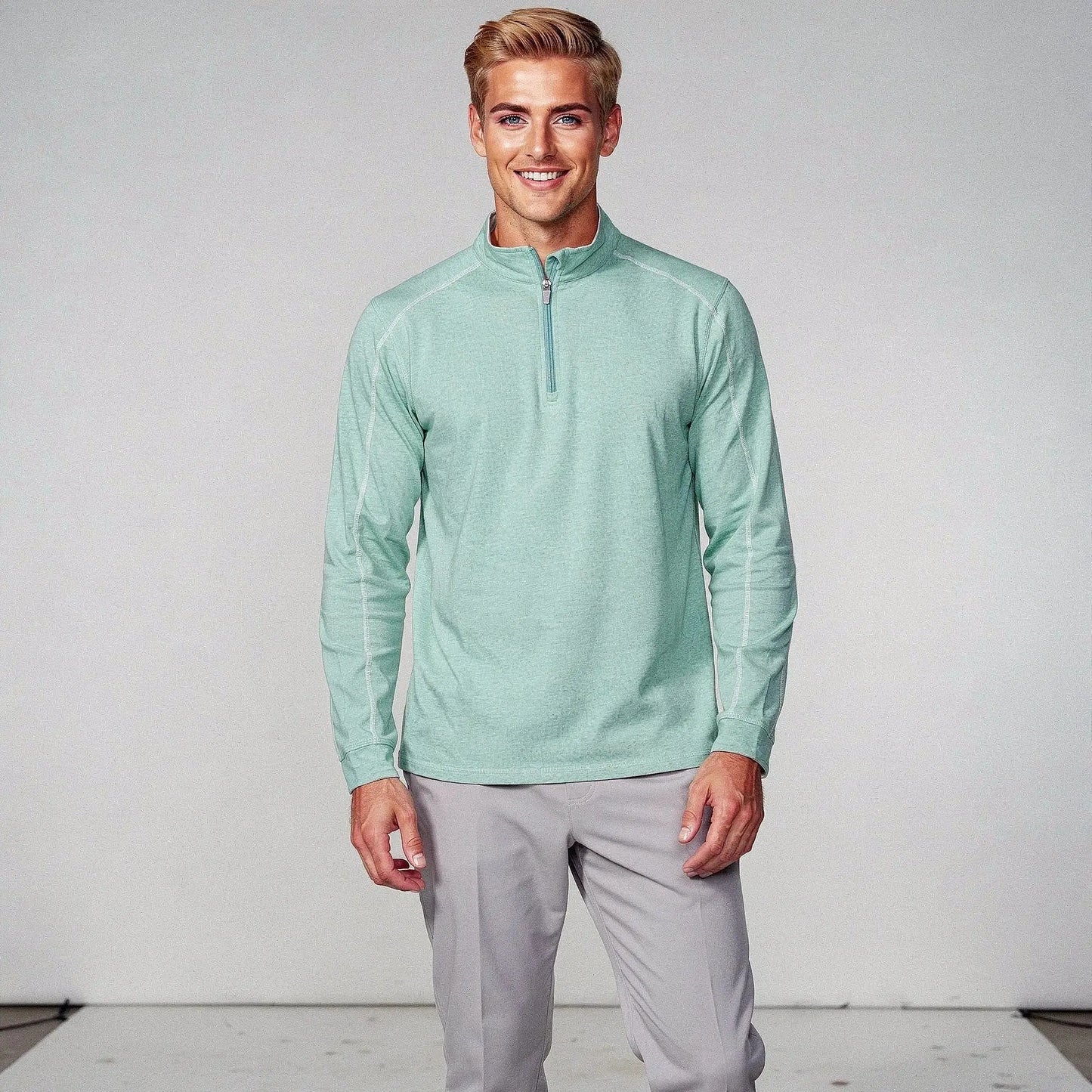 View of a lightweight quarter zip pullover in dark gray, featuring a slim fit and soft fabric for casual daywear