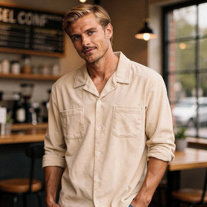 View of a light blue short sleeve camp collar shirt, featuring a relaxed fit and soft cotton fabric
