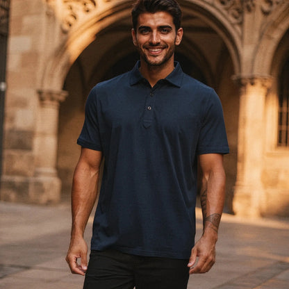 View of a navy blue slim fit short sleeve polo shirt with a V neck and soft cotton material