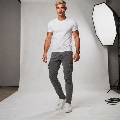 View of slim fit super stretch cargo trousers in dark gray, featuring multiple pockets and a comfortable waistband