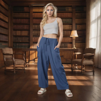 View of relaxed fit high rise wide leg comfort pants in soft fabric, featuring a light beige color and elastic waistband