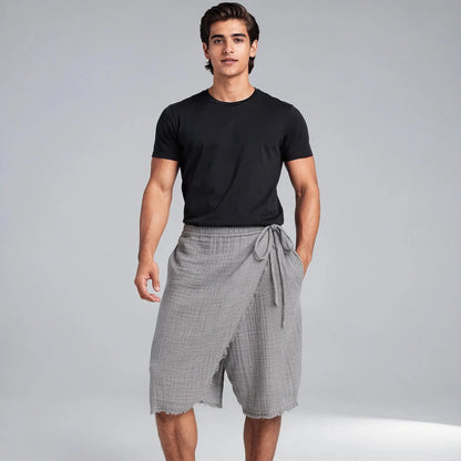 View of relaxed fit men's casual shorts in light gray, featuring a drawstring waist and loose summer design