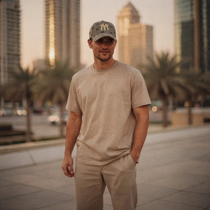 View of a navy blue slim fit crew neck short sleeve casual tee, showcasing soft fabric and stitching details