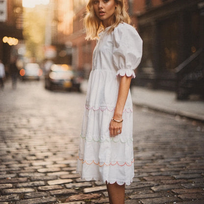 View of a flowy A line midi dress in soft fabric, featuring a round neck and a vibrant floral pattern